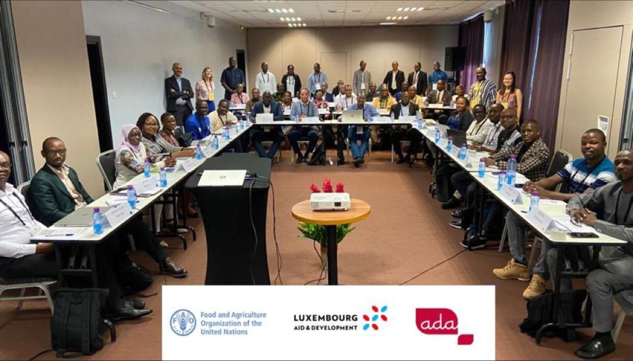 Group photo of training participants around a U-shaped table, with the FAO, Luxembourg Aid and Development and ADA logos