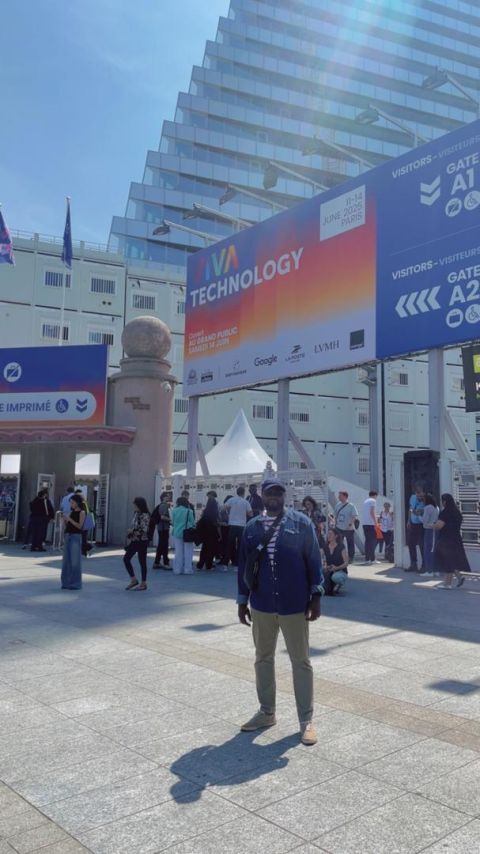 Eklin standing in front of the VivaTech entrance in Paris